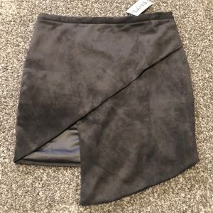 NWT. Gray mini skirt w asymmetrical front